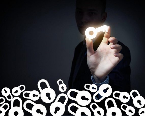 Man holding a glowing key above locked padlocks, symbolising hidden ultimate beneficial ownership